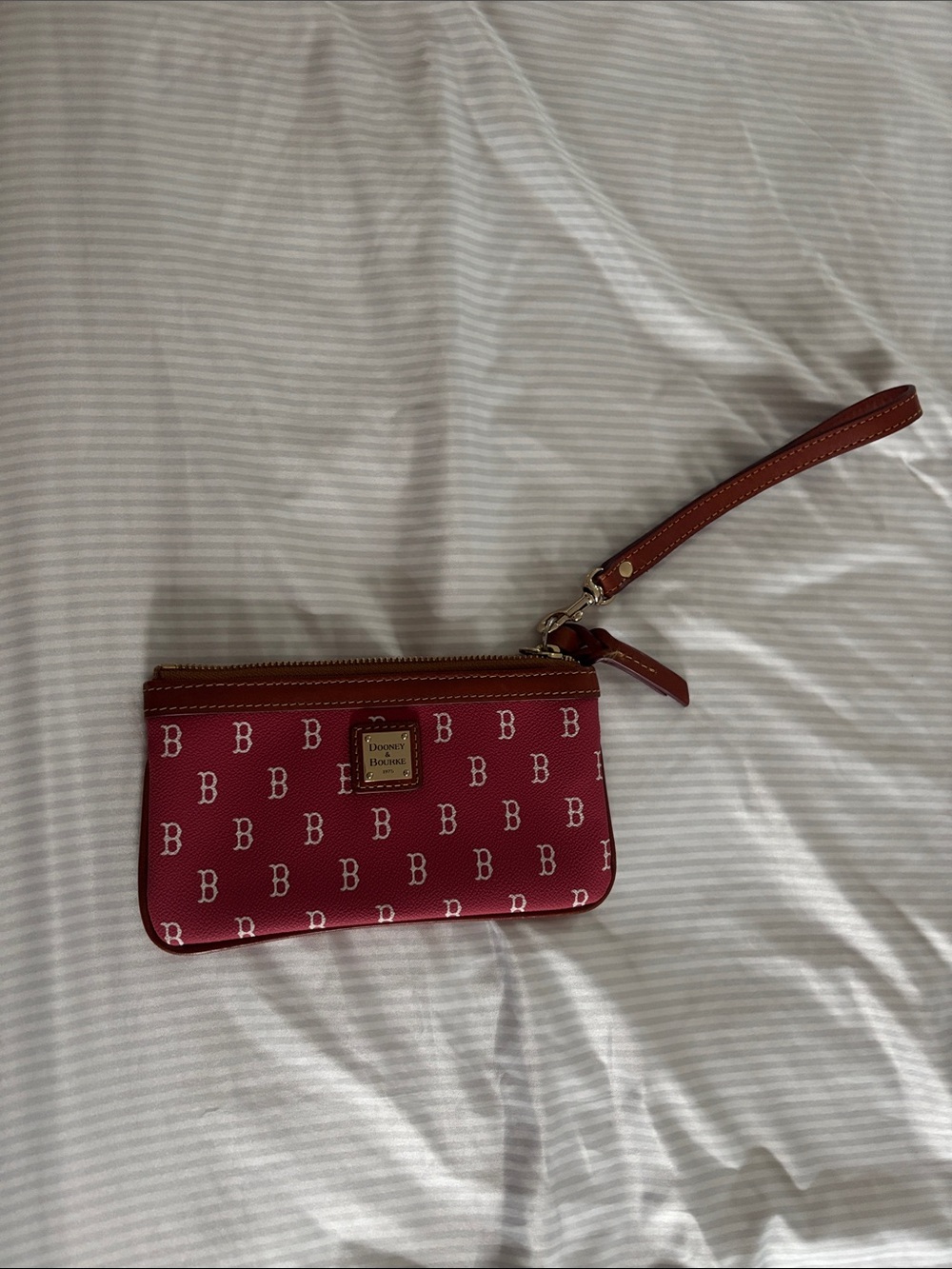 Dooney & Bourke Raspberry Logo Wristlet with Tan Strap